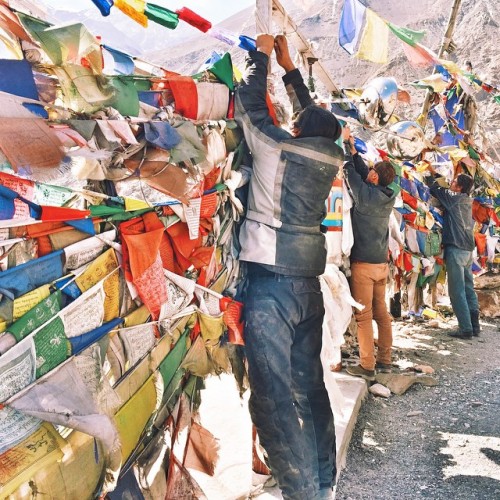 A prayer flag is a colorful rectangular cloth, often found strung along mountain ridges and peaks high in the Himalayas which predated Buddhism in Tibet.