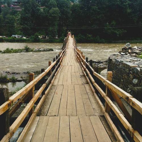 The iconic Bakhirna wooden bridge - build approximately a century ago on the glacial river Pubbar is located in Rohru.