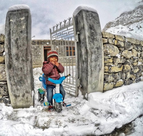 Lahaul and Spiti - cute little boy playing in the snow
