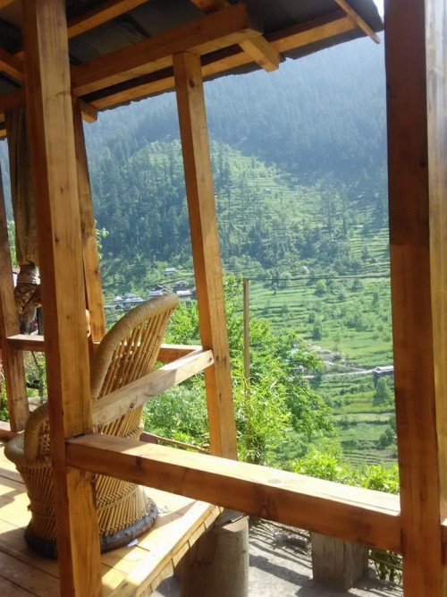 A view of hills from my cottage window. The cottage was made up of complete wooden stuff to make you feel always warm especially in winters